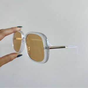 UO rounded square retro brown orange yellow tinted retro sunglasses